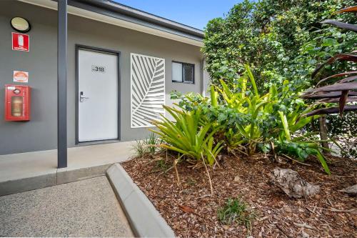 a building with a sign on the side of it at Quality Resort Parkhurst in Rockhampton
