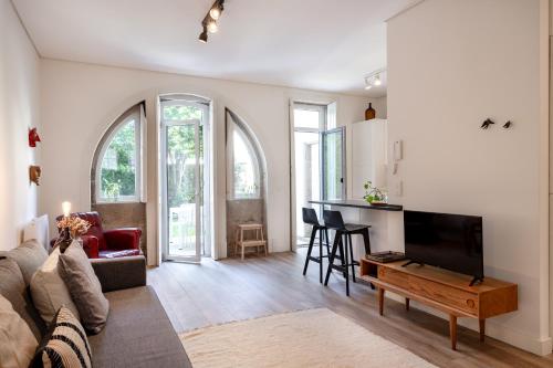 a living room with a couch and a table at VIVA Boavista Vintage House in Porto