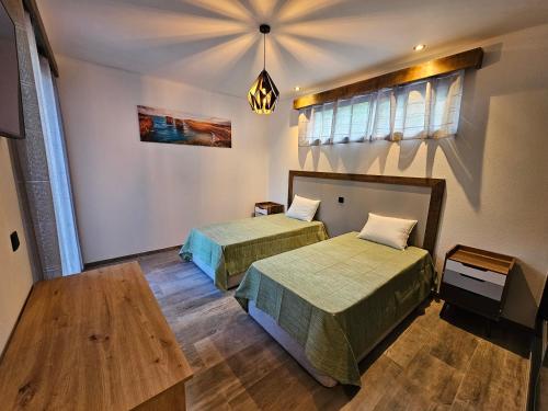 Postel nebo postele na pokoji v ubytování Casa Requinte - Jacuzzi