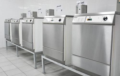 a row of stainless steel refrigerators in a store at Resa Emperador Carlos V in Granada