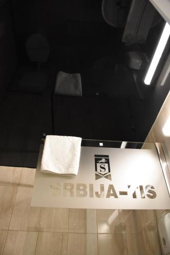 a room with a table with a towel on it at Hotel "Srbija Tis" in Zaječar