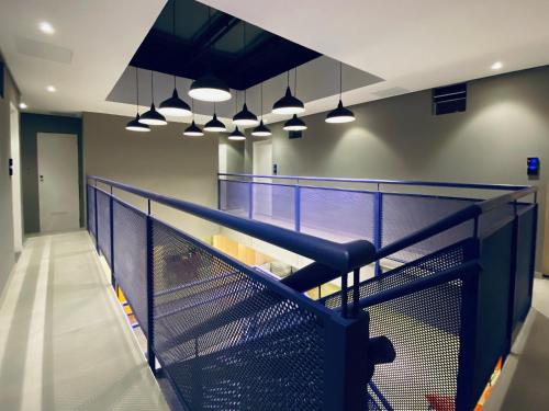 a view of a tennis court with lights at Sun Smart Hotel in Recife