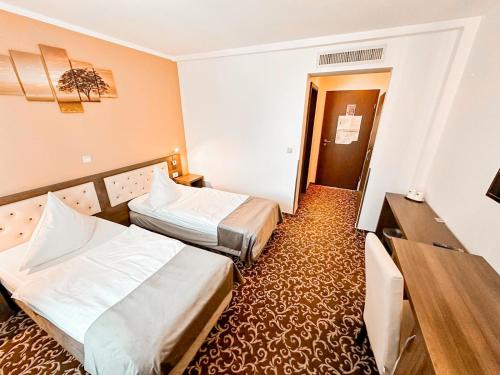 Cama o camas de una habitación en Hotel Neon