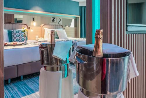 two champagne bottles in buckets in a hotel room at Royal Wings Hotel in Lara