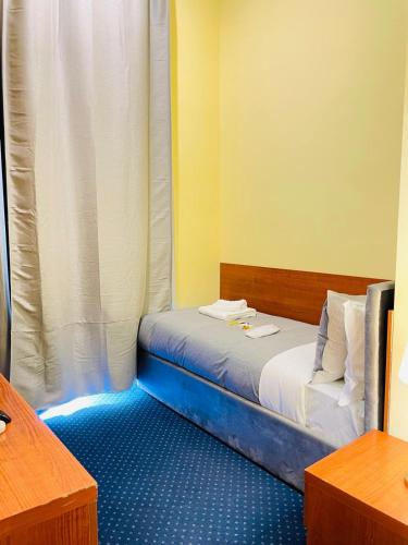 Postel nebo postele na pokoji v ubytování Hotel Rome place