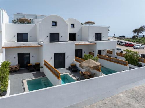 an aerial view of a building with a swimming pool at La Torretta Suites & Spa in Pirgos