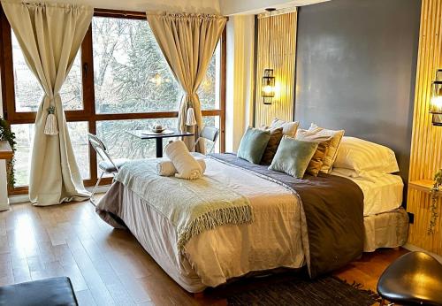 Postel nebo postele na pokoji v ubytování BlackBird Moreno1