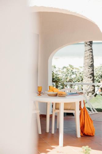 a white table with some food on top of it at Bungalows El Arenal in Jávea