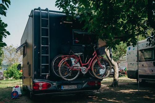 a bike is on the back of a truck at Montenegro Camper in Podgorica