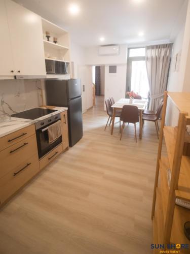 a kitchen and dining room with a table and a dining room at Old town lofts in Chalkida