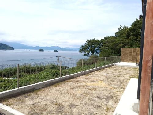 a view of the water from the balcony of a house at nagi-setouchi in Kure