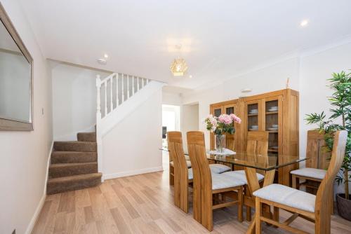 a kitchen and dining room with a table and chairs at GuestReady - A Haven by the River in Manchester