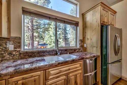 a kitchen with a sink and a window at Cubby Bear at Heavenly Tahoe - Pets in South Lake Tahoe