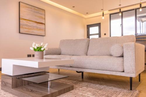 a living room with a couch and a table at Tufaha Resort in Nanyuki
