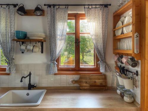 a kitchen with a sink and a window at Chalupa Nový Vojířov čp. 27 in Nová Bystřice