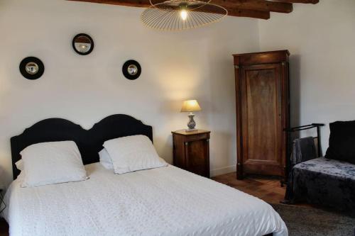 Ένα ή περισσότερα κρεβάτια σε δωμάτιο στο Le Clos de l'Authion