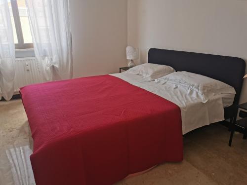 En eller flere senge i et værelse på Cenerina Home Due Mari