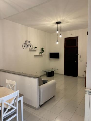 a living room with a couch and a bike on the wall at Casa Balai in Porto Torres