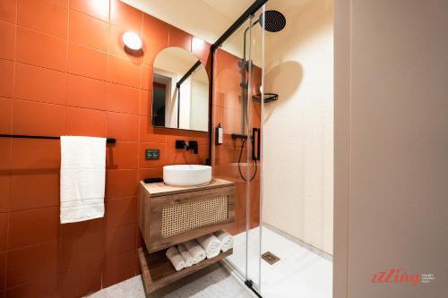 a bathroom with a sink and a shower at Stuart Rooms by Zzzing in Il-Gżira
