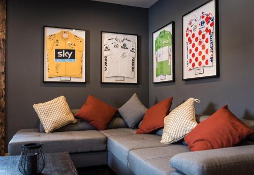 a living room with a couch and pictures on the wall at Nant Morzine in Morzine