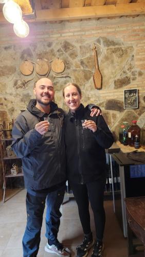 een man en een vrouw met een glas wijn bij KHORGO in Gori