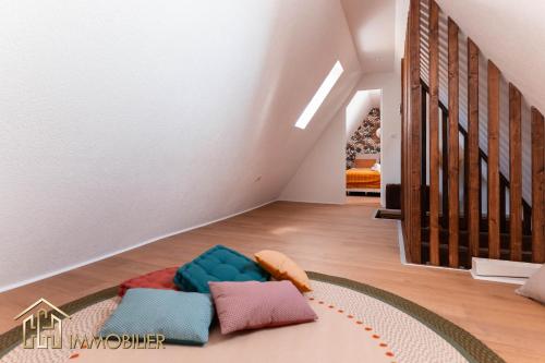 a living room with a couch on the floor at Chez Hansi & Emmy - Gueberschwihr in Gueberschwihr