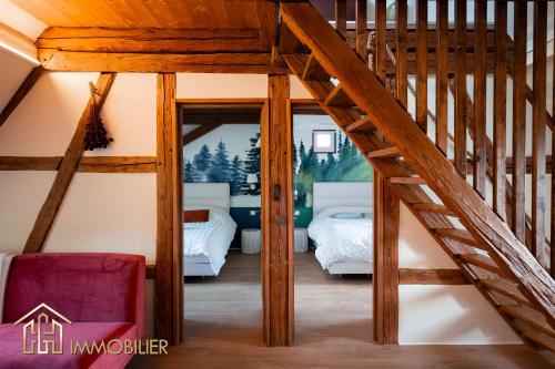 a bedroom in a house with a attic at Chez Hansi & Emmy - Gueberschwihr in Gueberschwihr