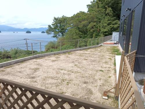 a patio with a view of the water at nagi-setouchi in Kure