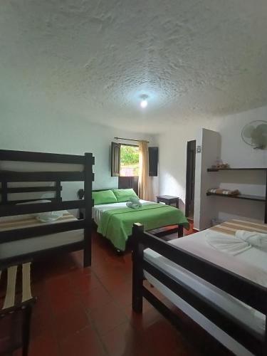 Hotel Campestre Casona del Camino Realにあるベッド