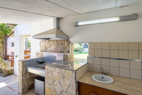 A kitchen or kitchenette at Villa Morenanoemi - private pool