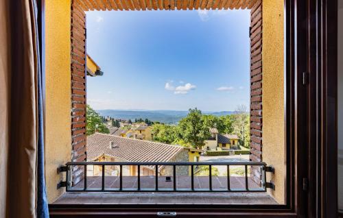 a window with a view of a city at Nice Apartment In Monteverdi Marittimo in Monteverdi Marittimo