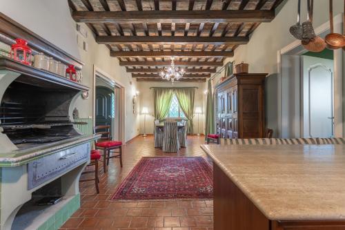 a kitchen with a stove and a counter top at La Betulla - Ocean-Mountain View LUX in Montone