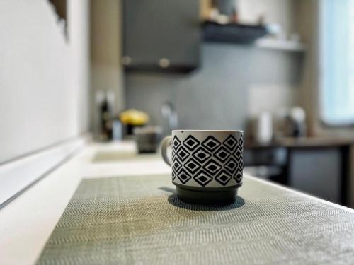 a coffee cup sitting on a counter in a kitchen at Love me Bianca 2 in Crema