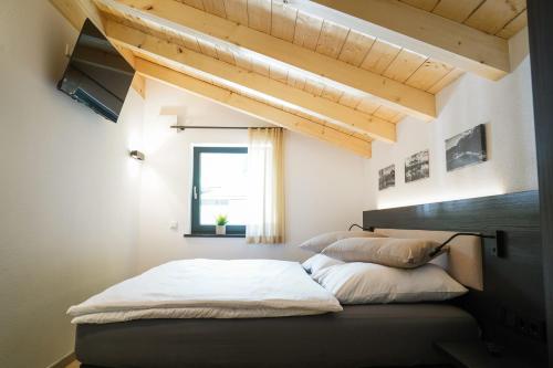 מיטה או מיטות בחדר ב-Chalet Weibhauser