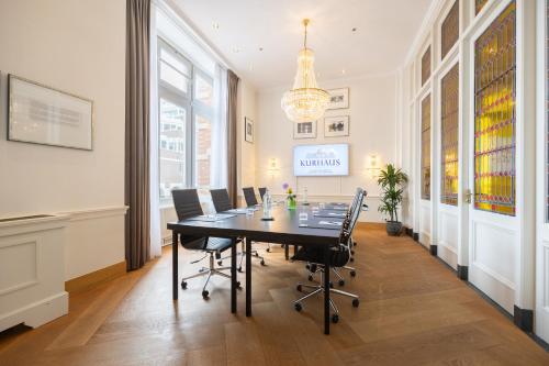a conference room with a table and chairs at Grand Hotel Amrâth Kurhaus The Hague Scheveningen in Scheveningen