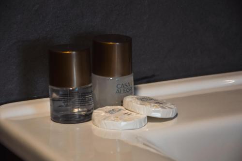 two toothbrushes and a bottle of glue on a sink at Casa Alegre Alaçatı in Alacati