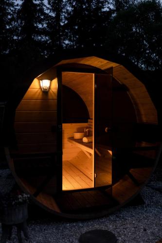 a round room with a mirror in the middle of a tunnel at Beskid Loft House - domki w górach in Sól