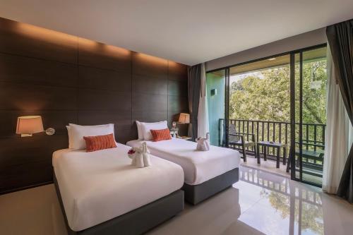 מיטה או מיטות בחדר ב-Aree Tara Ao Nang Krabi