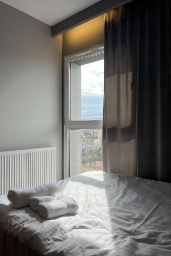 Кровать или кровати в номере Apartamenty Panorama