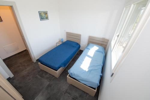 Giường trong phòng chung tại Casa Vacanza Poggio Paniere