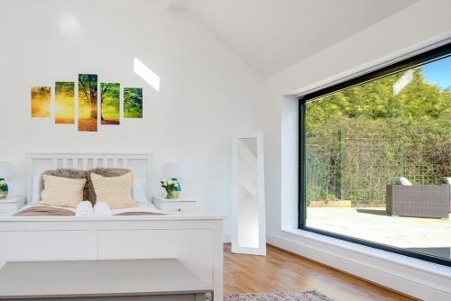 Ένα ή περισσότερα κρεβάτια σε δωμάτιο στο Country Chalet New Forest