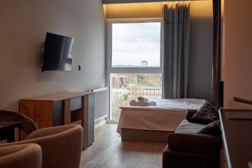 Кровать или кровати в номере Apartamenty Panorama