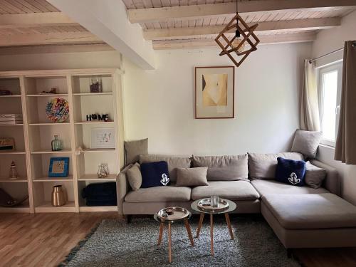 a living room with a couch and a table at Sailors Home Stari Bar in Bar
