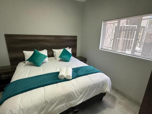 Katil atau katil-katil dalam bilik di Beswick Guesthouse