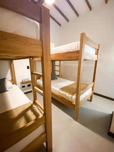 a bedroom with two bunk beds in a room at Casa García Rent Home in Guatapé