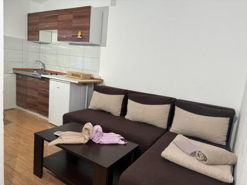 a living room with a couch and a table at Villa Happy Family!!! in Prijevor