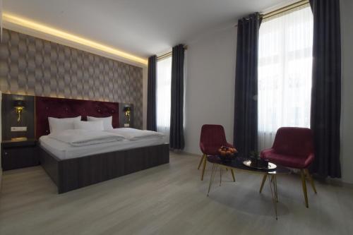Postel nebo postele na pokoji v ubytování Hotel Grand Inn Berlin - Weißensee