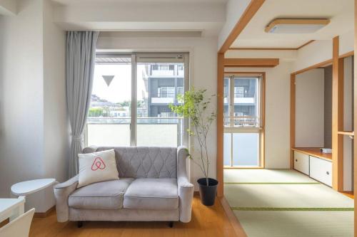 En eller flere senge i et værelse på SKY GATE Azabu