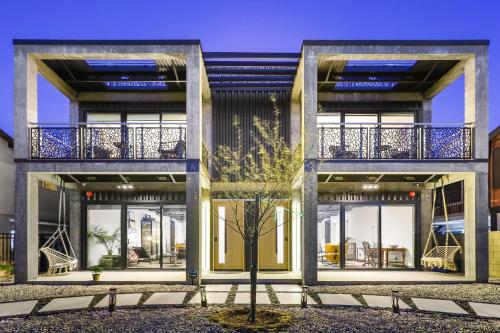 a rendering of a house with large windows at NEW Luxury Concrete Home Just Minutes from the Beach in Long Beach