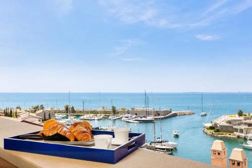 a view of a marina with boats in the water at Portopiccolo Apartments in Sistiana